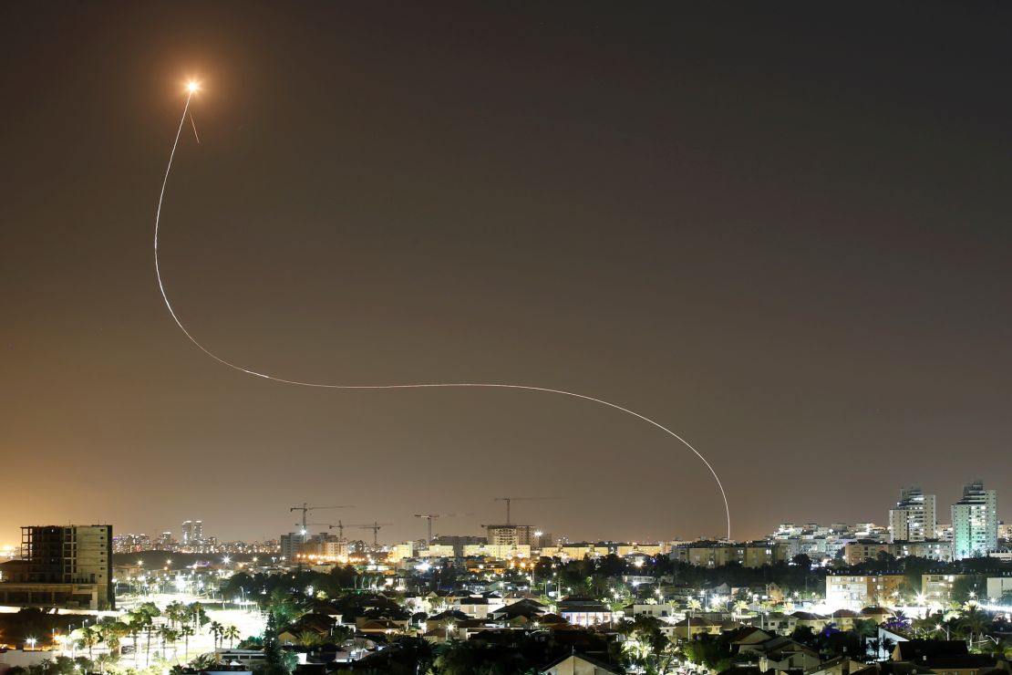 A streak of light is seen from Ashkelon as Iron Dome intercepts rockets launched from Gaza towards Israel on May 11.