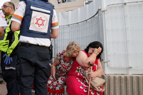 Israeli rescue teams help residents of an Ashkelon neighborhood on May 11.