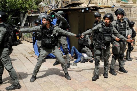 Israeli police detain a Palestinian during clashes at the Aqsa Mosque on May 10.