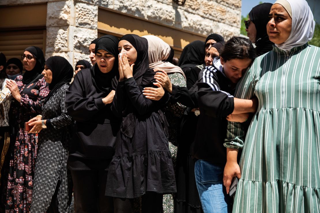 Mourners react during the funeral of Israeli Arab Khalil Awaad and his daughter Nadine, 16, in the village of Dahmash near the Israeli city of Lod, on Wednesday.
