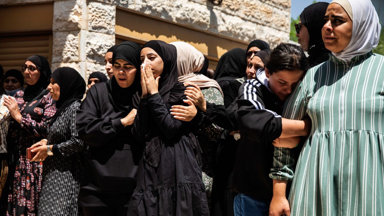 Mourners react during the funeral of Israeli Arab Khalil Awaad and his daughter Nadine, 16, in the village of Dahmash near the Israeli city of Lod, on Wednesday.
