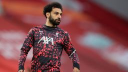 Liverpool's Egyptian midfielder Mohamed Salah warms up ahead of the English Premier League football match between Liverpool and Southampton at Anfield in Liverpool, north west England on May 8, 2021. - - RESTRICTED TO EDITORIAL USE. No use with unauthorized audio, video, data, fixture lists, club/league logos or 'live' services. Online in-match use limited to 120 images. An additional 40 images may be used in extra time. No video emulation. Social media in-match use limited to 120 images. An additional 40 images may be used in extra time. No use in betting publications, games or single club/league/player publications. (Photo by Alex Pantling / POOL / AFP) / RESTRICTED TO EDITORIAL USE. No use with unauthorized audio, video, data, fixture lists, club/league logos or 'live' services. Online in-match use limited to 120 images. An additional 40 images may be used in extra time. No video emulation. Social media in-match use limited to 120 images. An additional 40 images may be used in extra time. No use in betting publications, games or single club/league/player publications. / RESTRICTED TO EDITORIAL USE. No use with unauthorized audio, video, data, fixture lists, club/league logos or 'live' services. Online in-match use limited to 120 images. An additional 40 images may be used in extra time. No video emulation. Social media in-match use limited to 120 images. An additional 40 images may be used in extra time. No use in betting publications, games or single club/league/player publications. (Photo by ALEX PANTLING/POOL/AFP via Getty Images)