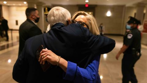 Cheney gets a hug from US Rep. John Carter, a Republican from Texas, after Wednesday's vote.