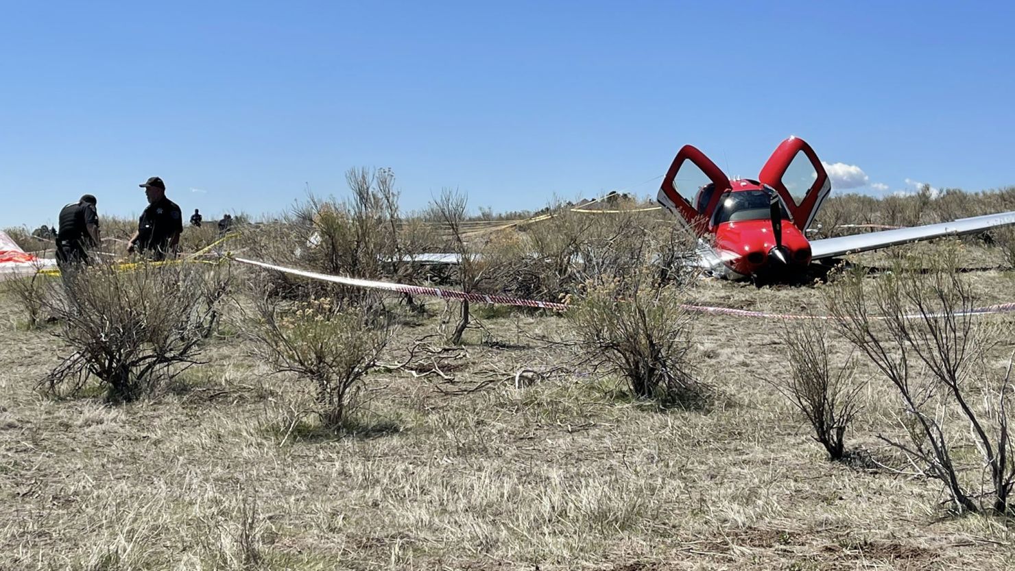 One of the planes used a parachute (far left) and descended slowly to the ground, an official said.