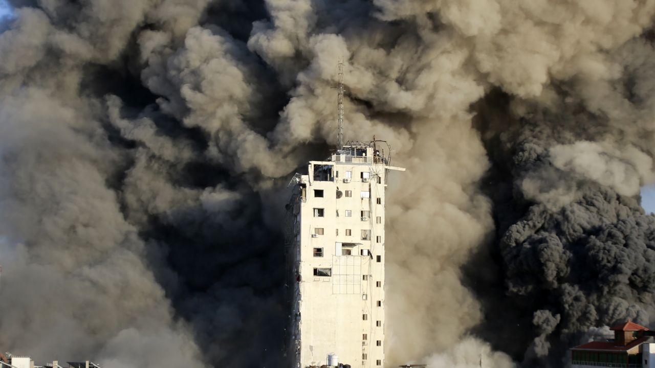 Smoke rises from a tower building destroyed by Israeli airstrikes.