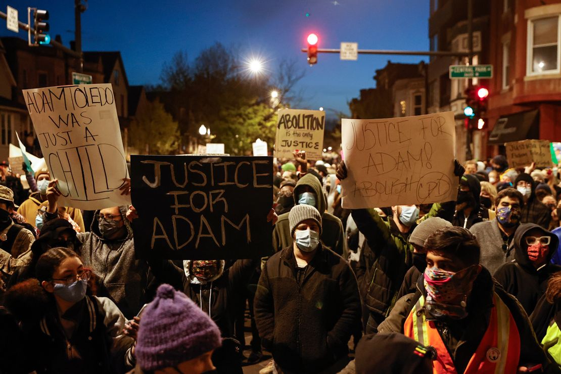 Protesters march through Logan Square neighborhood during a protest on April 16, 2021, over the killing of 13-year-old Adam Toledo.