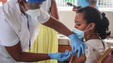 A medical personel injects the first dose of the Chinese Covid-19 vaccine produced by Sinopharm at the Seychelles Hospital in Victoria, on January 10, 2021. 