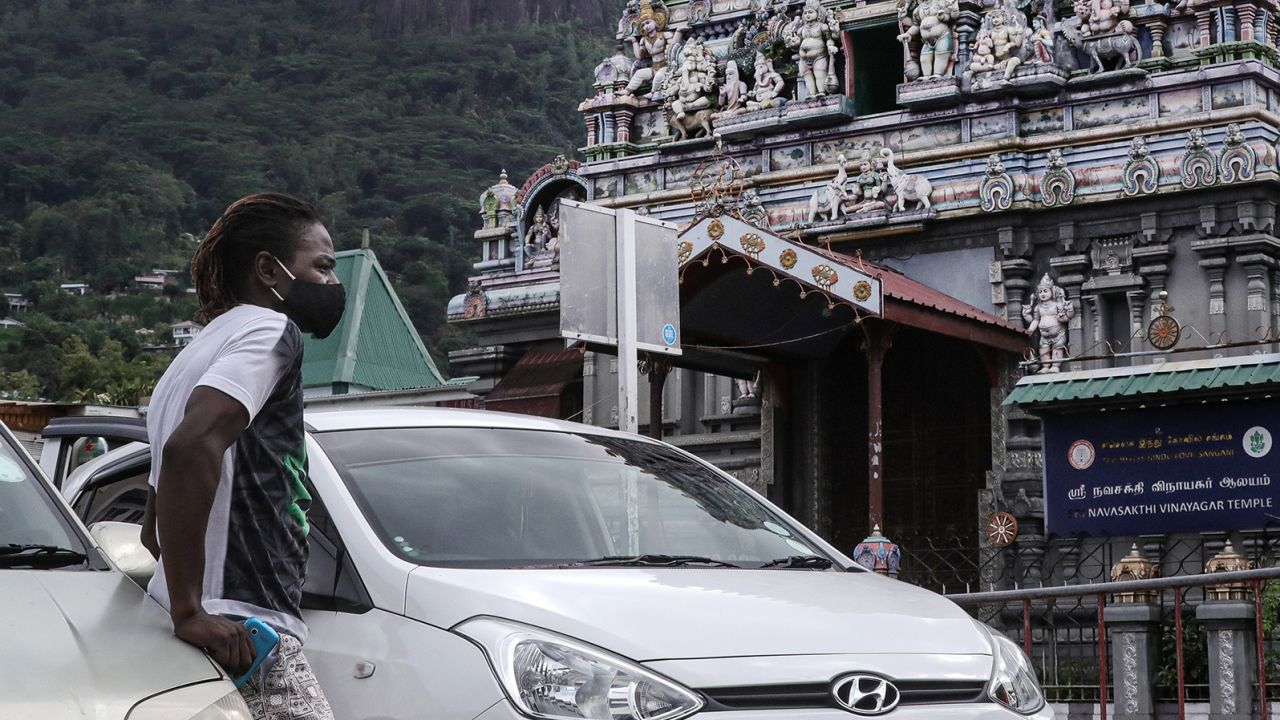 A man outside Arul Mihu Navasakthi Vinayagar Temple in Seychelles' capital Victoria on April 3, 2021. 