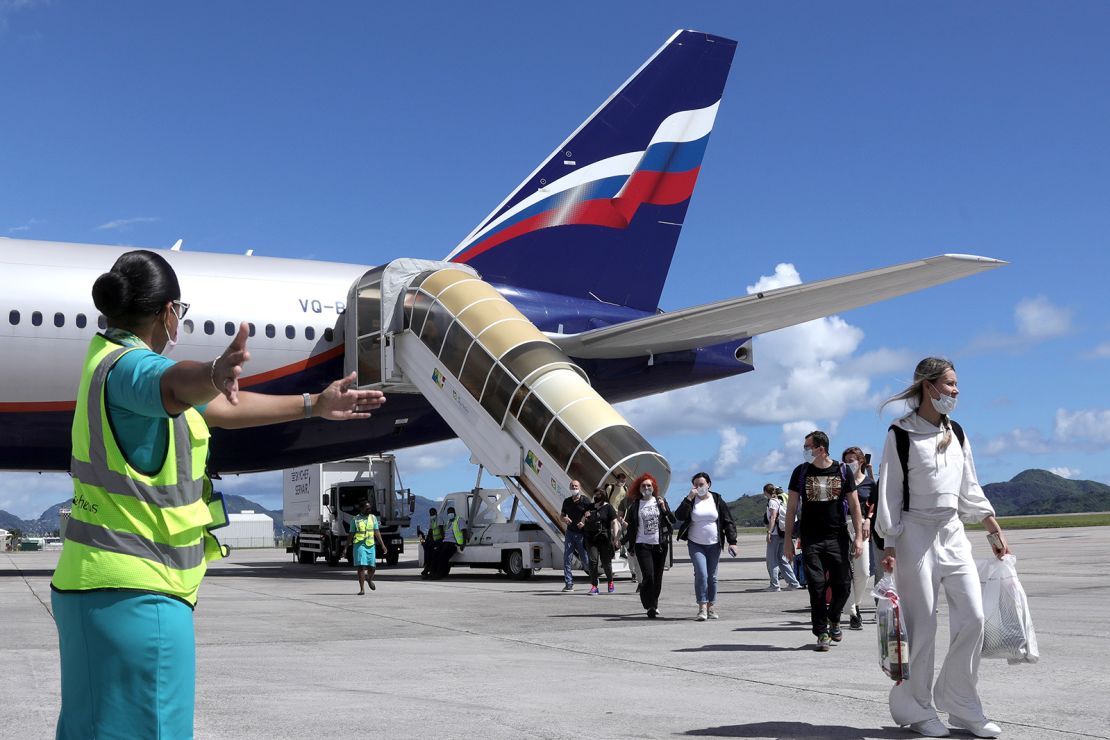Passemgers leave a Boeing 777-300ER plane from Russia to Mahe Island, Seychelles, in April 2021.