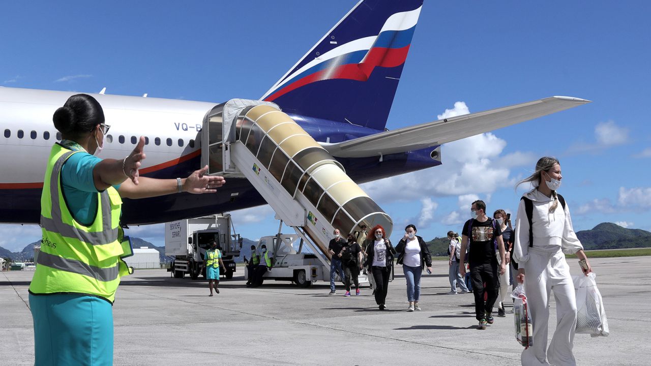 Passemgers leave a Boeing 777-300ER plane from Russia to Mahe Island, Seychelles, in April 2021.