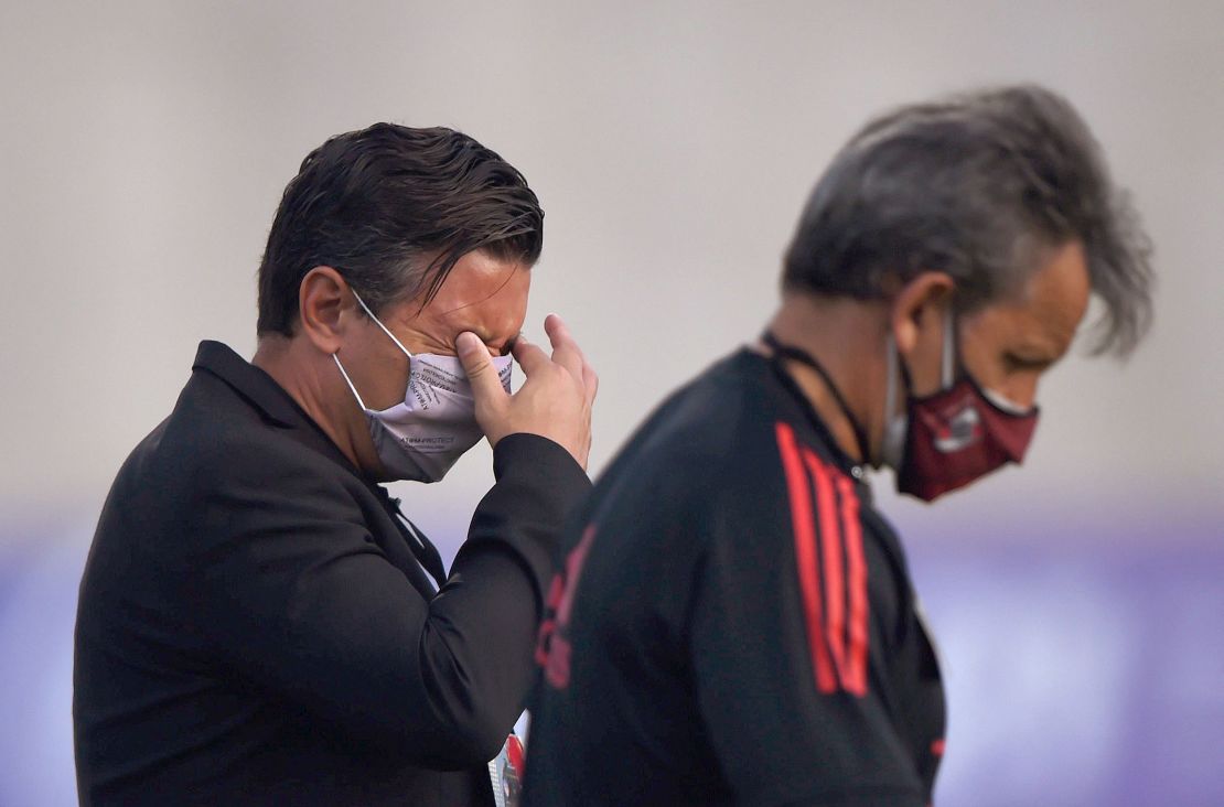 River Plate coach Marcelo Gallardo reacts to tear gas thrown outside the stadium.