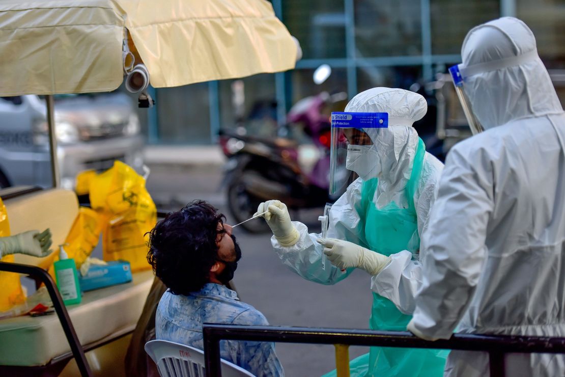 A medical worker swabs a man for a Covid-19 test in Male in June, 2020.