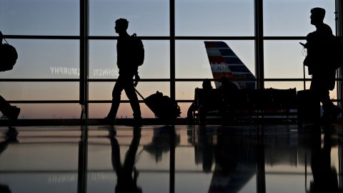 Travelers walk through Ronald Reagan National Airport in Washington, D.C.