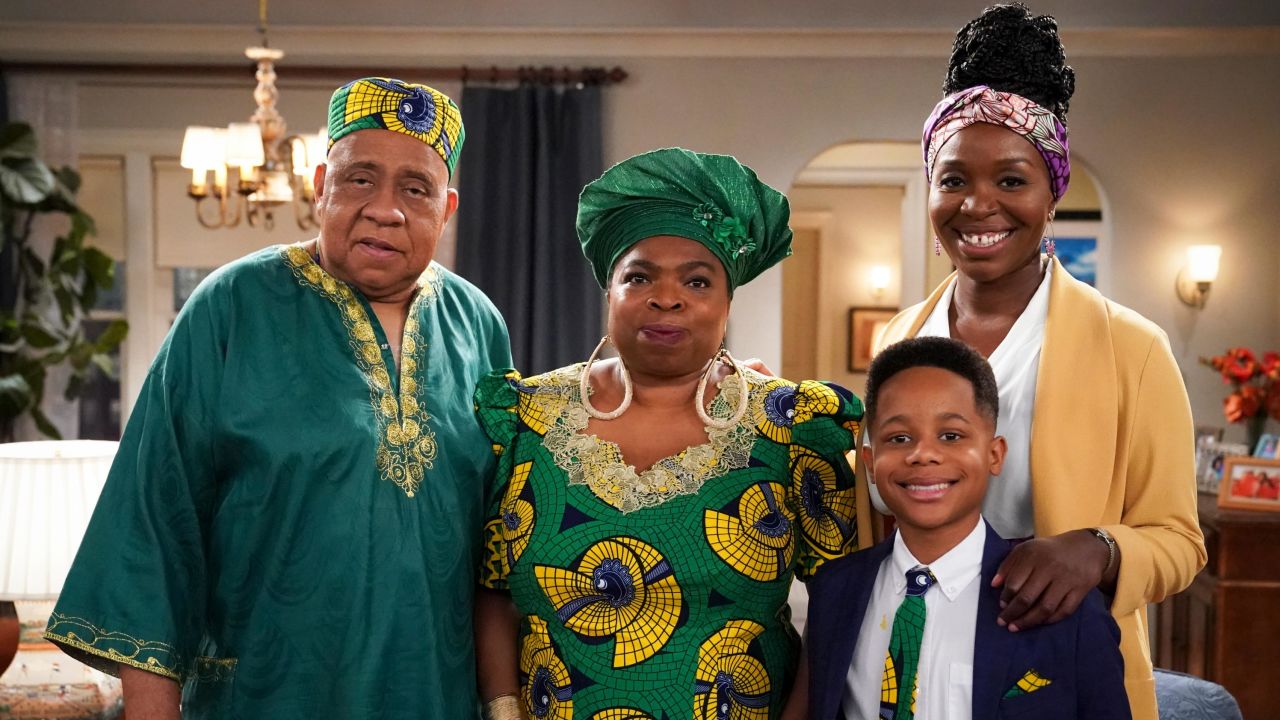 On the show, Abishola and her son live with her Nigerian aunt and uncle in Detroit, Michigan. Pictured (L-R): Barry Shabaka Henley as Uncle Tunde, Shola Adewusi as Auntie Olu, Travis Wolfe, Jr. as Dele, and Olowofoyeku as Abishola.