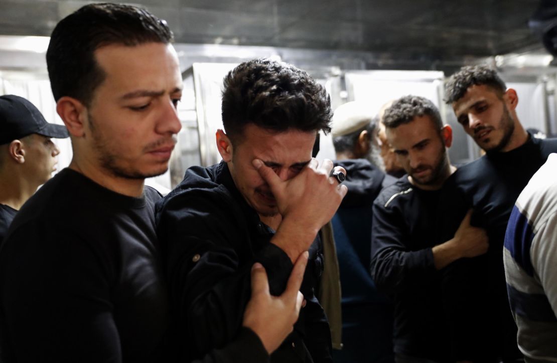 Relatives mourn Wednesday during the funeral of Reema Telbani and her 5-year-old son Zaid, who were killed in an airstrike on Gaza City.