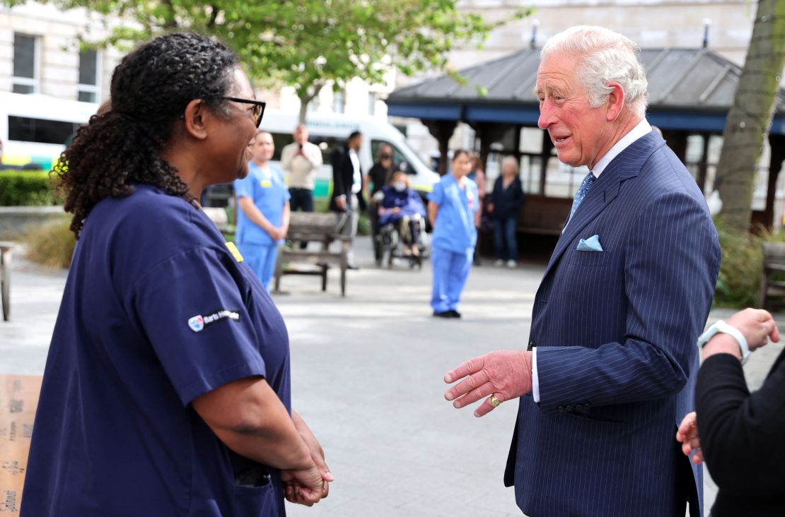 Charles speaks with nursing staff during a visit to St. Bartholomew's Hospital.