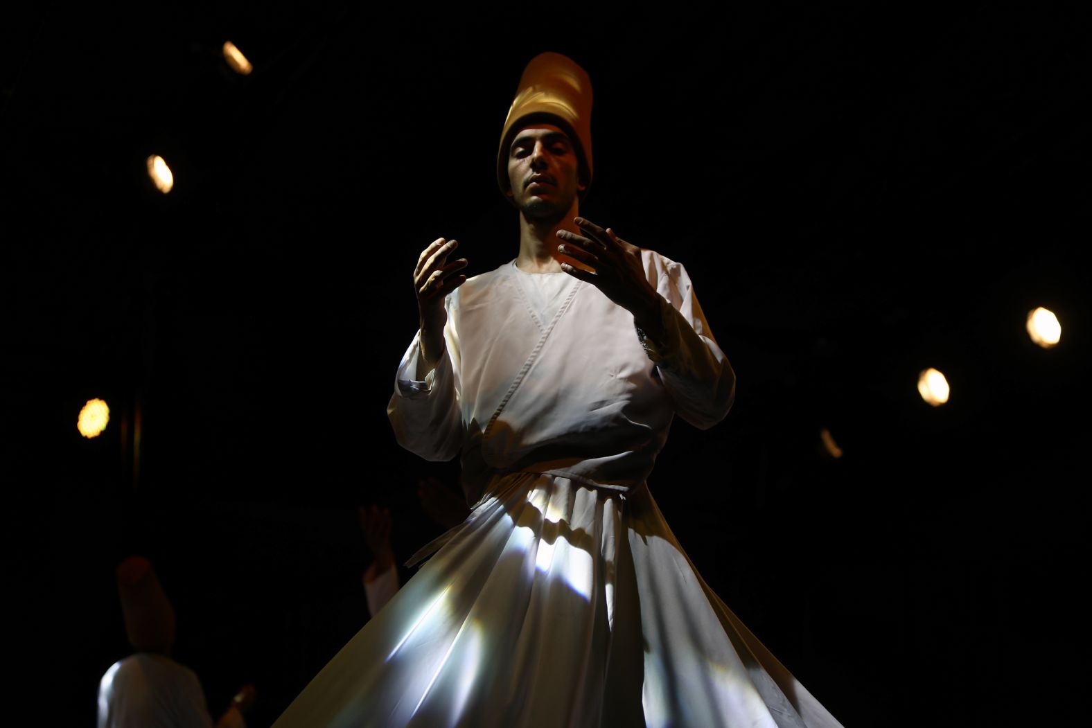 A dancer performs a Sufi dance at a party in Cairo on May 1.