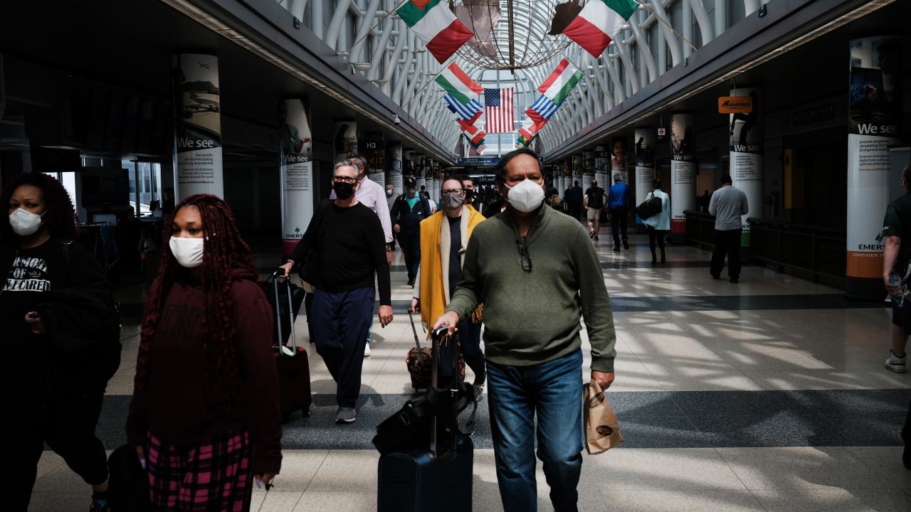 CHICAGO, ILLINOIS - APRIL 26: People walk through Chicago O'Hare airport on April 26, 2021 in Chicago, Illinois. As the number of the people vaccinated against COVID-19 increases throughout the nation, people are beginning to travel by air again. Nearly 1.6 million Americans flew on April 18, 2021 while just over 105,000 Americans flew on the same day in 2020. (Photo by Spencer Platt/Getty Images)