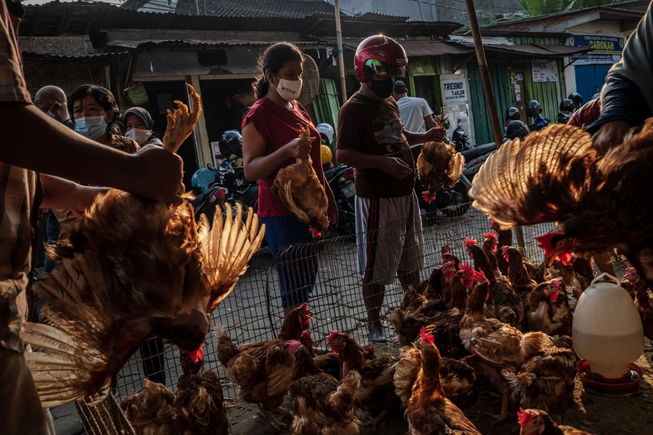 People buy chicken at a market in Yogyakarta, Indonesia, as they prepare for Eid al-Fitr on Wednesday, May 12.