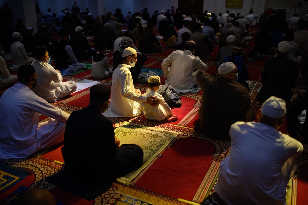 Muslims gather for an Eid al-Fitr prayer, marking the end of the holy month of Ramadan, at the Bradford Central Mosque in Bradford, England, on Thursday, May 13.
