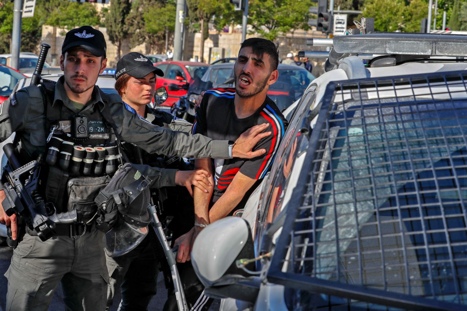 Israeli security forces detain a Palestinian man outside the Damascus Gate in Jerusalem's Old City on May 13.