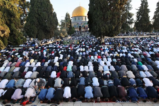 Muslims perform the morning Eid al-Fitr prayer, marking the end of the <a href="index.php?page=&url=http%3A%2F%2Fwww.cnn.com%2F2021%2F04%2F13%2Fworld%2Fgallery%2Framadan-2021%2Findex.html" target="_blank">holy fasting month of Ramadan,</a> in the Aqsa mosque compound in Jerusalem on May 13.