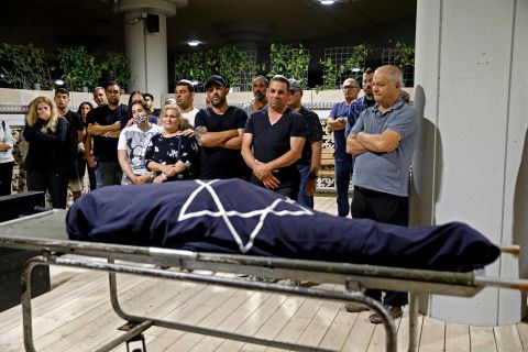 Mourners surround the body of Lea Yom Tov, an Israeli woman killed by a rocket attack from Gaza, during her funeral in Rishon LeZion, Israel, on May 12.