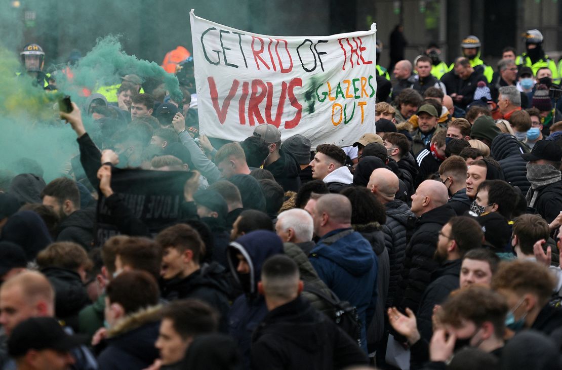 Demonstrators protest against Manchester United's owners outside Old Trafford.