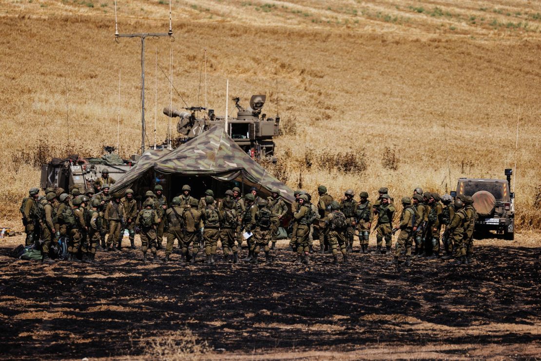 An artillery unit of Israeli soldiers  gather on the Israeli side of the border between Israel and Gaza, on May 14.