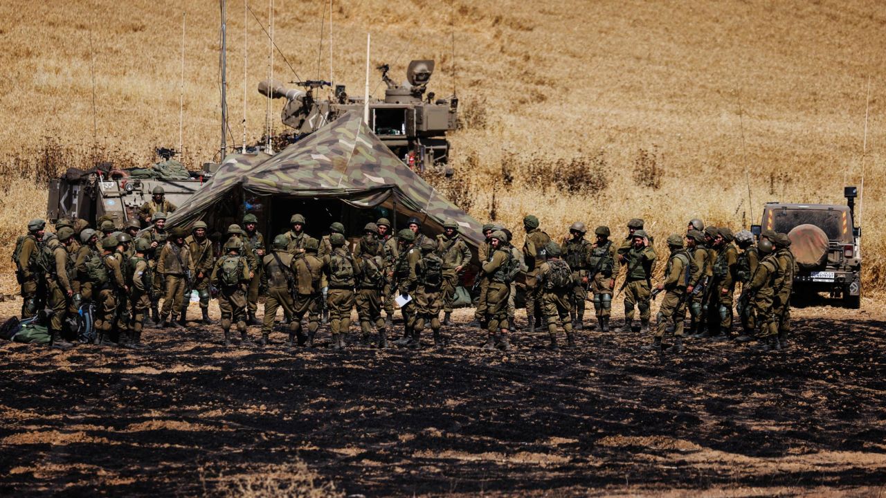 An artillery unit of Israeli soldiers gather on the Israeli side of the border between Israel and Gaza, on May 14.