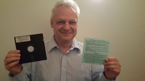 Eddy Willems with his original floppy disc with ransomware from 1989