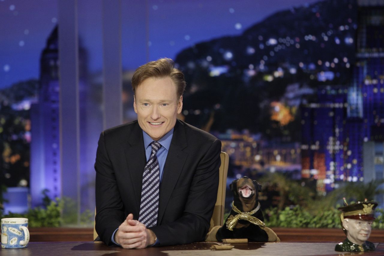 O'Brien is joined by Triumph the Insult Comic Dog, one of his show's most iconic characters, in 2009.
