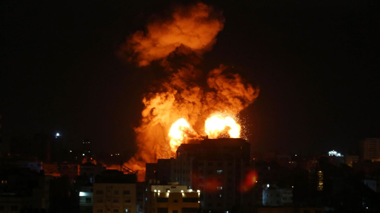 Smoke and flames rise after Israeli fighter jets conducted airstrikes in Gaza City, Gaza, on May 13.
