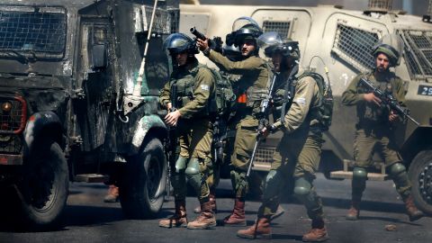 Israeli forces fire teargas canister at Palestinian demonstrators during clashes near the Jewish settlement of Beit El near Ramallah in the West Bank on Friday.