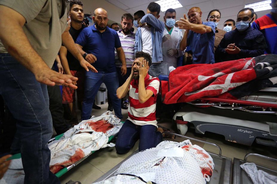 Relatives mourn over the bodies of the Abu Khatab family, who were killed in an Israeli airstrike, at the Shifa Hospital morgue in Gaza City on May 15.