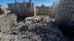 A tower housing the Associated Press, Al Jazeera, and other media offices collapses after Israeli missile strikes in Gaza City, on Saturday, May 15.