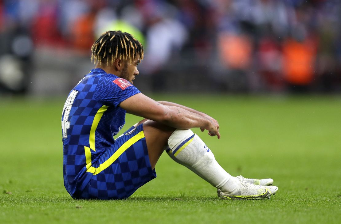 Reece James sits downcast on the pitch after Chelsea's defeat in Saturday's FA Cup final. 