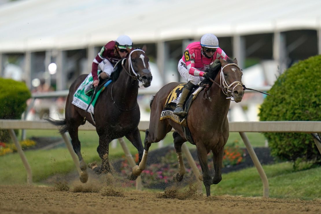 Flavien Prat atop Rombauer, right, breaks away from Irad Ortiz Jr. atop Midnight Bourbon moments before crossing the finish line to win the Preakness Stakes.