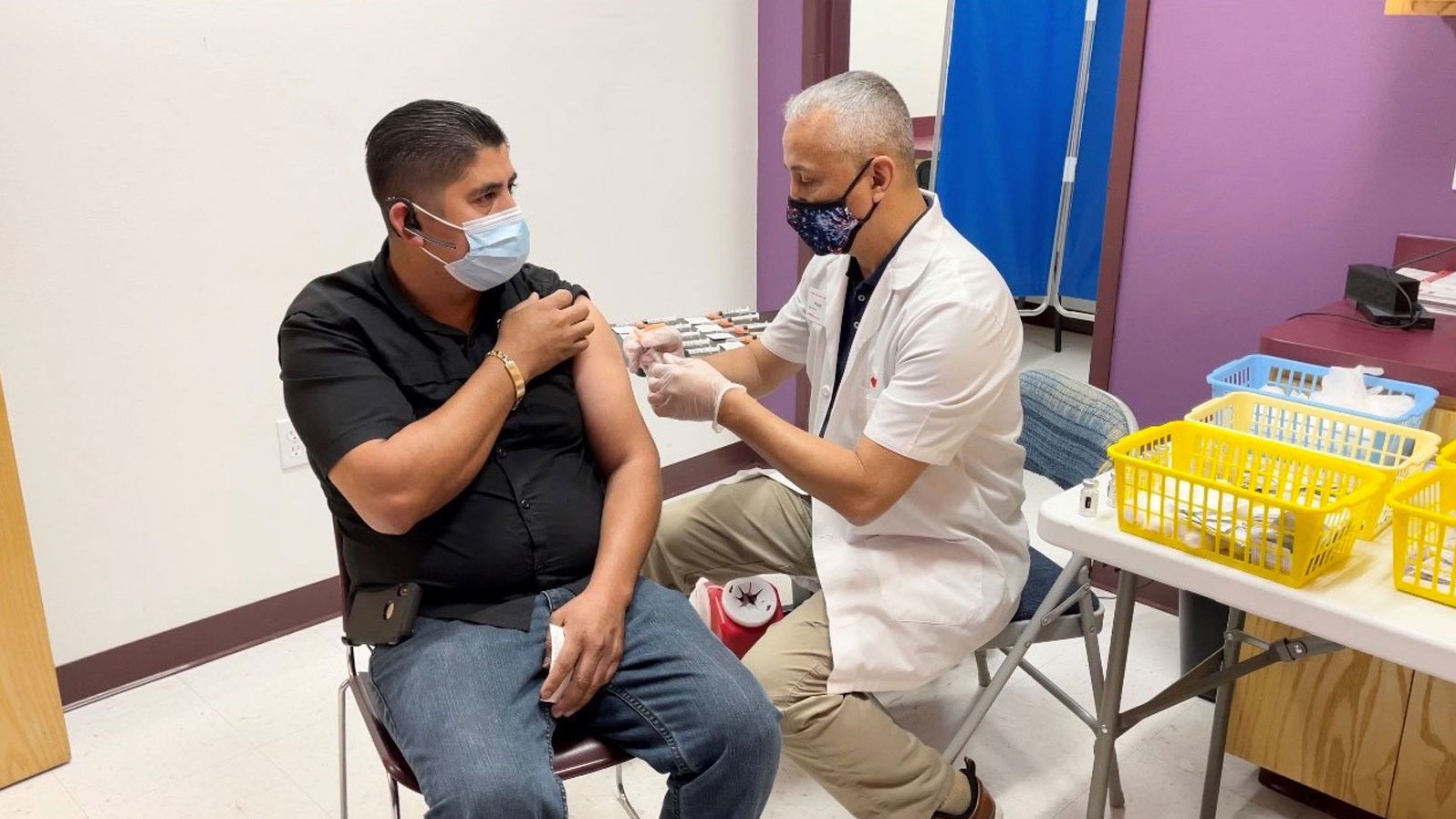 Frank Arredondo immunizing a patient.