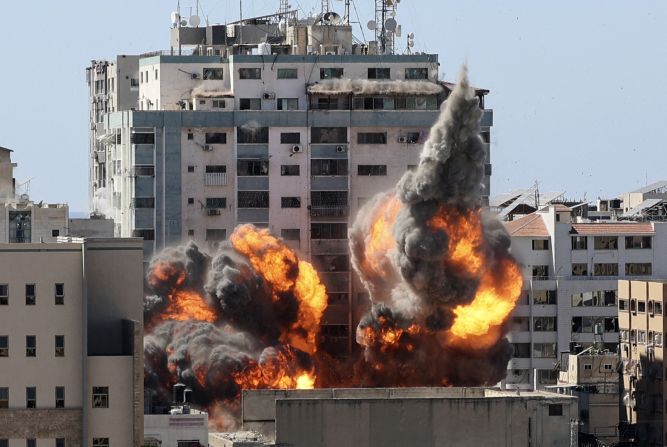 A ball of fire erupts from the Jala'a Tower, which houses the Associated Press, Al Jazeera and other media offices, as it is <a href="index.php?page=&url=https%3A%2F%2Fwww.cnn.com%2F2021%2F05%2F15%2Fmedia%2Fassociated-press-al-jazeera-gaza-bombings%2Findex.html" target="_blank">destroyed by an Israeli airstrike</a> in Gaza City on Saturday, May 15.