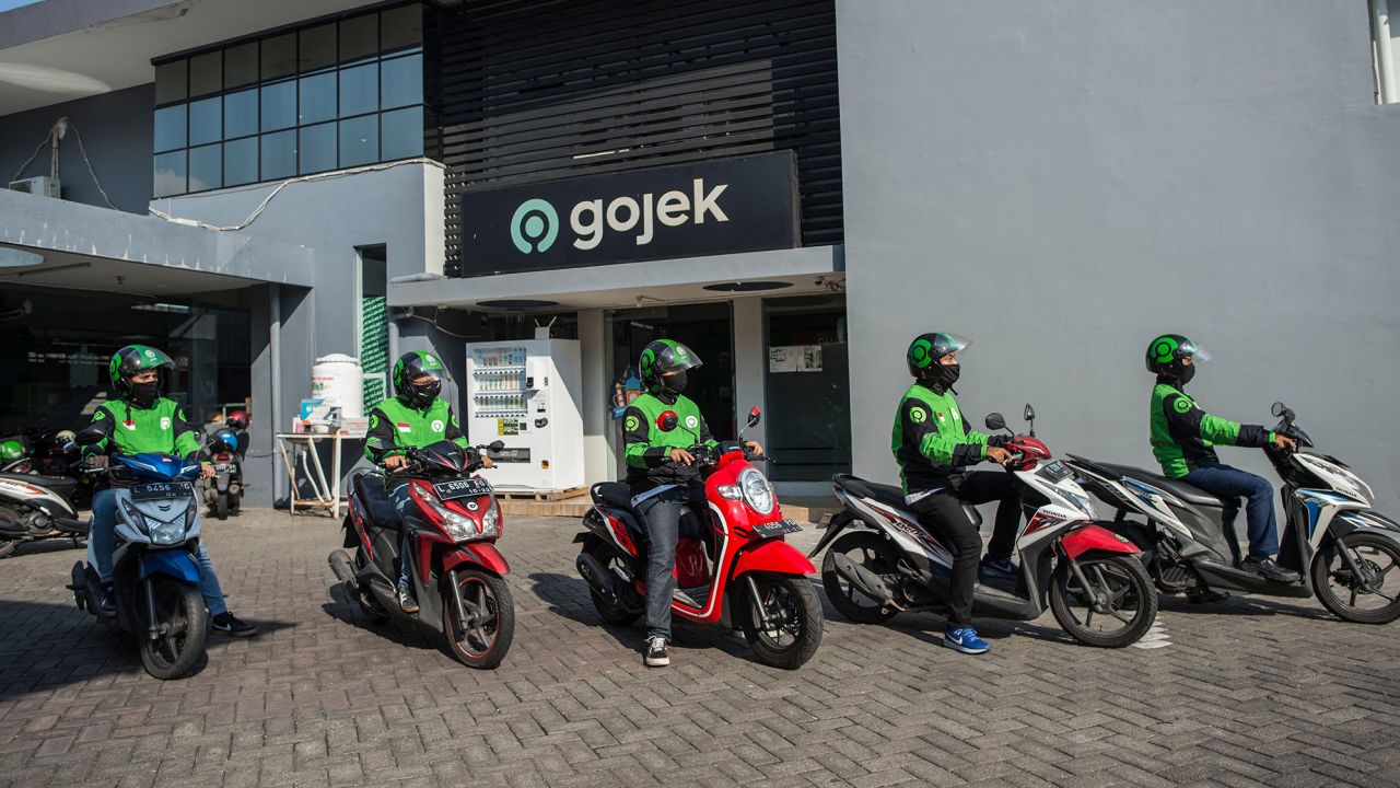Gojek riders wait for orders at a distribution center in Surabaya, Indonesia on May 17, 2021. 