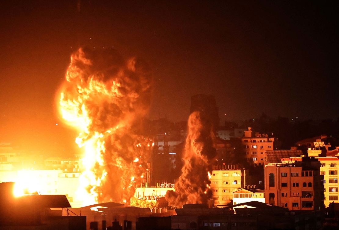 Smoke rises above buildings in Gaza City as Israeli warplanes target the Palestinian enclaves early Monday. 