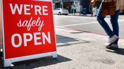 A sign announces that a restaurant is "safely open" in Los Angeles, California on June 24, 2020 amid a record rise in coronavirus cases across the state.