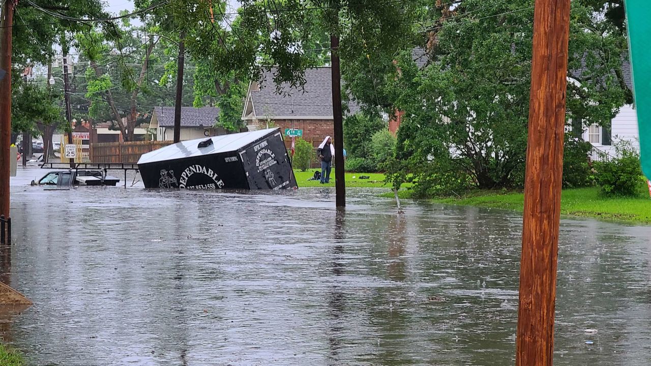 A truck is stranded in the flooded streets of Lake Charles. 