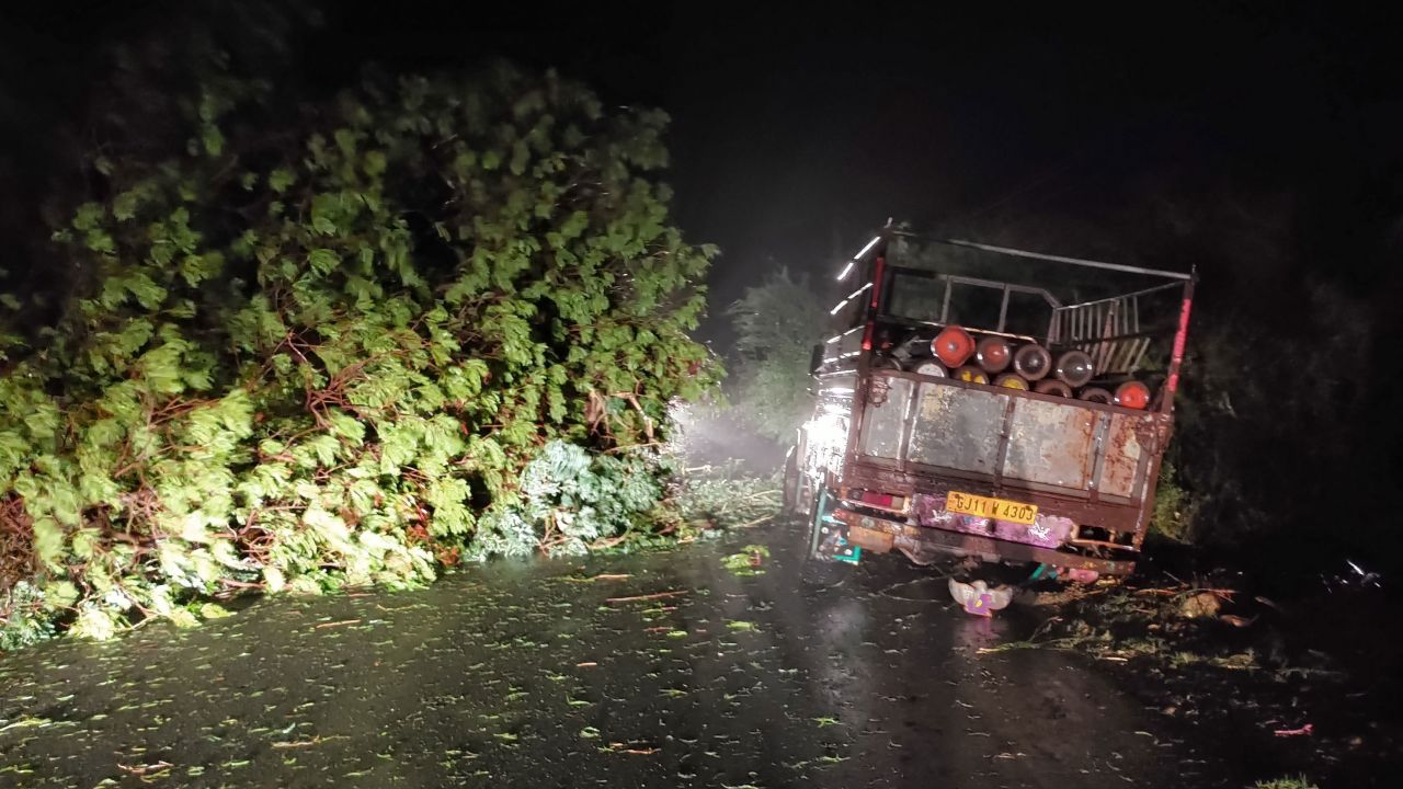 A truck loaded with oxygen cylinders stuck as trees fell due to Cyclone Tauktae, near Mahuva in Gujarat state, India, on May 17.