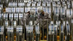 WUHAN, CHINA - MAY 08 2021: Two staff work in MIZ Metal Product Wuhan Co. Ltd., a joint venture between Japan's Itochu-Marubeni Steel Inc. and its Chinese partner, in Wuhan in central China's Hubei province Saturday, May 08, 2021.
