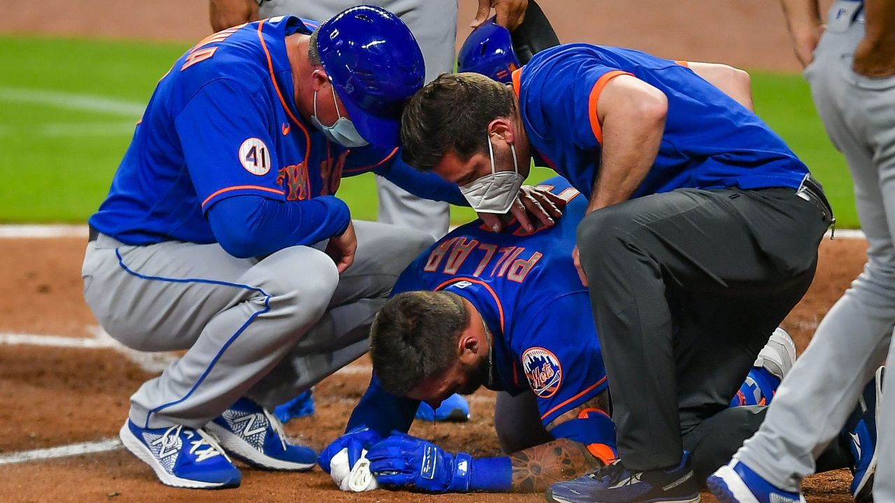 Staff rushes to Kevin Pillar moments after he was hit by a pitch.
