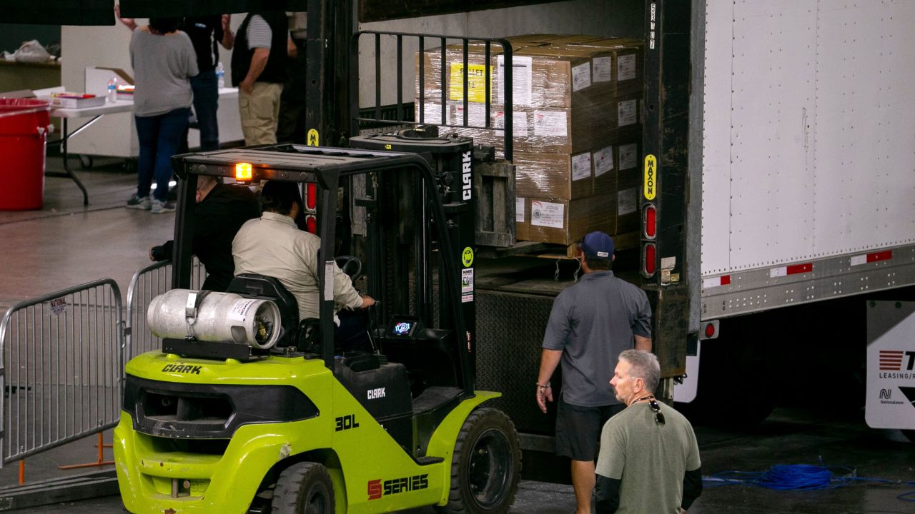 Maricopa County ballots from the 2020 general election are boxed up and moved offsite from the floor of the Veterans Memorial Coliseum where they were being examined and recounted by contractors hired by the Arizona senate in Phoenix on May 14, 2021. The Arizona senate was forced to pause their recount of the ballots as various high school graduations were slated to begin inside the coliseum.