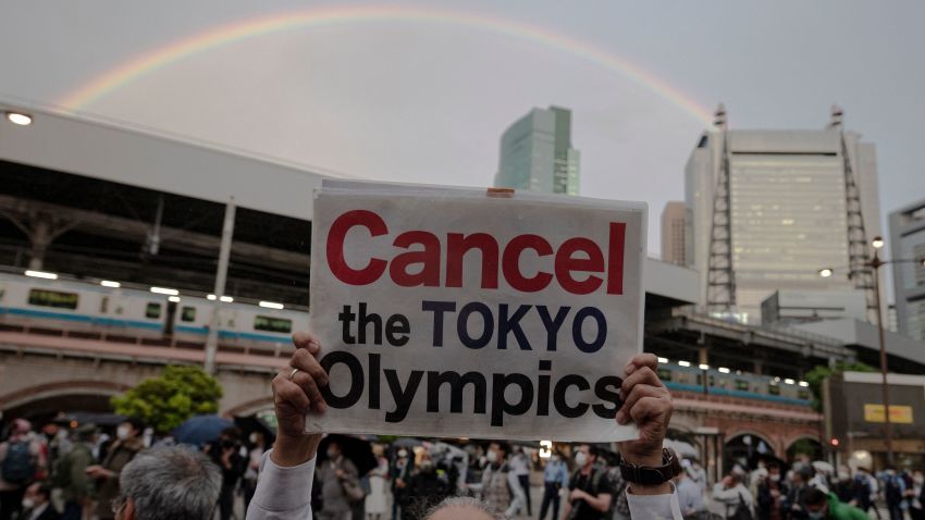 TOPSHOT - People take part in a protest against the hosting of the 2020 Tokyo Olympic Games in Tokyo on May 17, 2021. (Photo by Charly TRIBALLEAU / AFP) (Photo by CHARLY TRIBALLEAU/AFP via Getty Images)