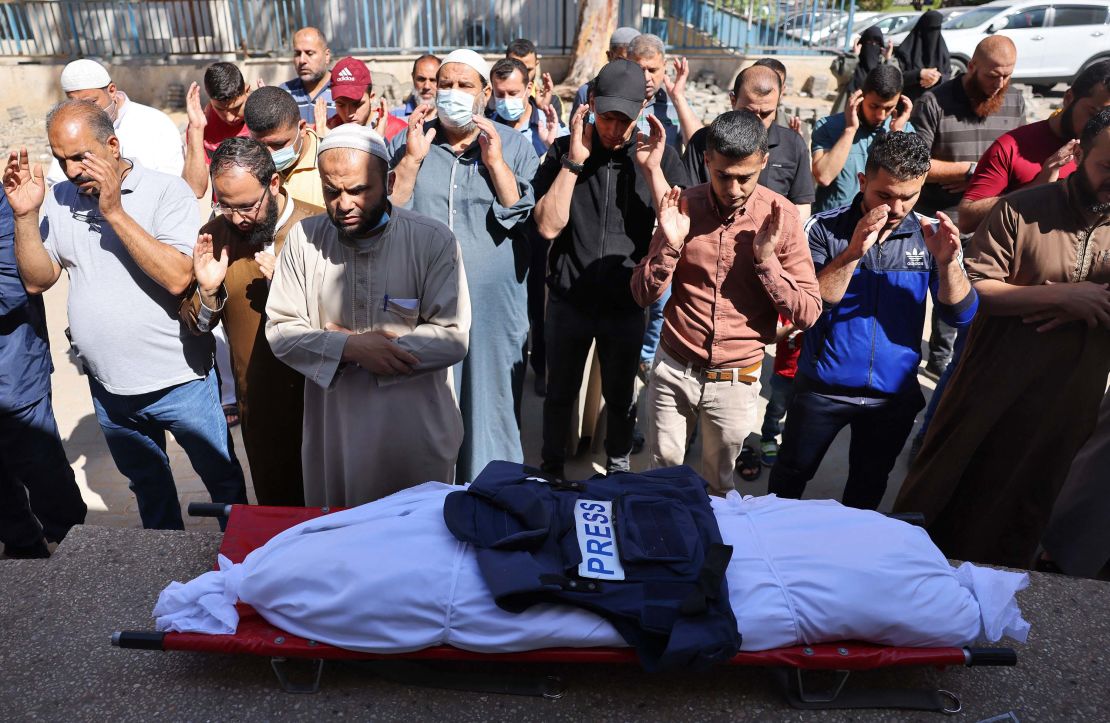 Palestinians attend the funeral of a journalist working for Al-Aqsa radio. The journalist was killed when an Israeli strike hit his home north of Gaza City, on May 19.